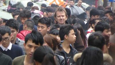 Michael Wood standing in a crowd of people
