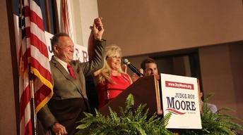 Roy Moore allegations shake Washington, Trump visits Asia