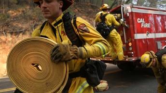 California wildfire death toll rises as teams search ruins