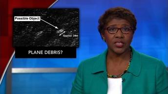 News Wrap: Satellite image of debris shifts Malaysia search