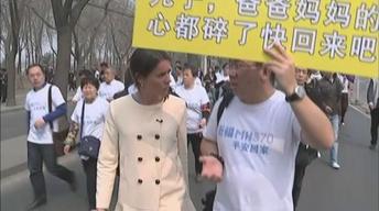 News Wrap: Relatives of Flight 370 passengers hold protest