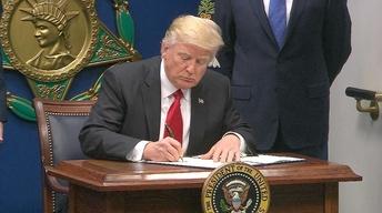Two federal courts block new travel ban