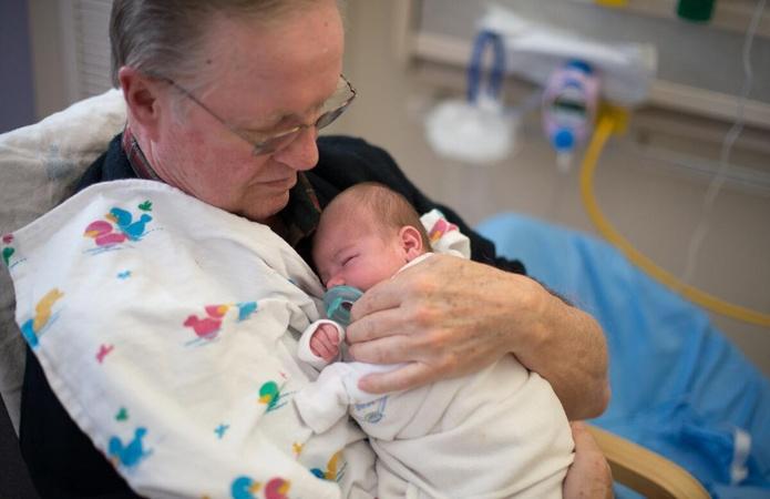 Retired Adults Volunteer as Baby Cuddlers