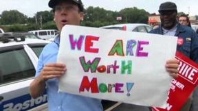 Image of Workers protest low pay, but some argue increases kill jobs