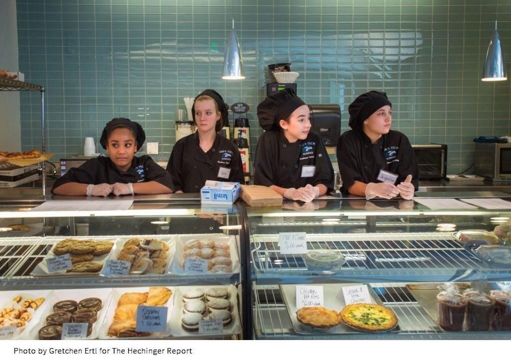 Freshmen in the Culinary Arts program wait for customers at the bakery counter