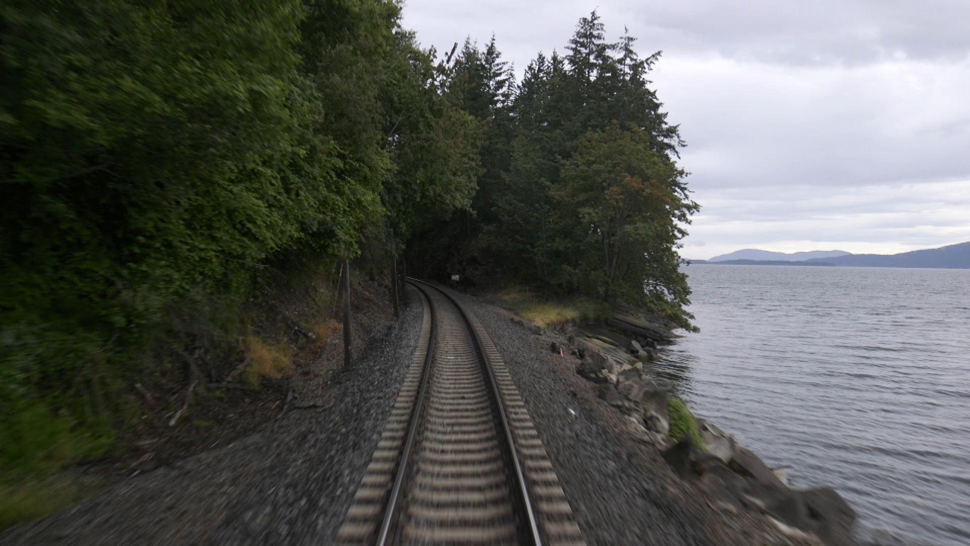 The Rocky Mountaineer hugs the waters edge.