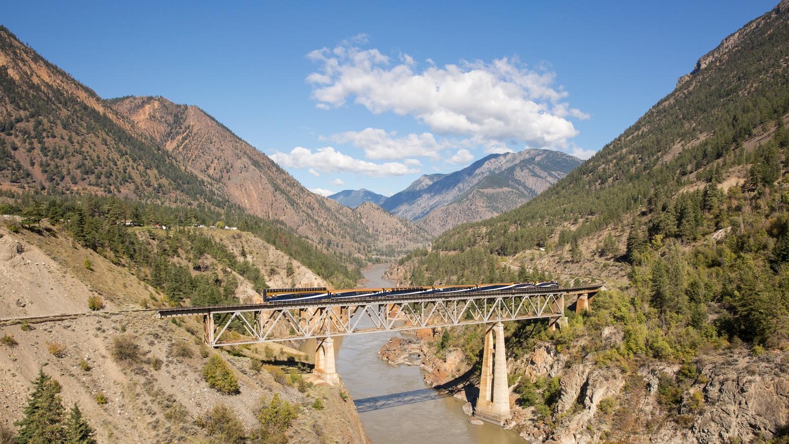 Rocky Mountaineer traveling across the Fraser River