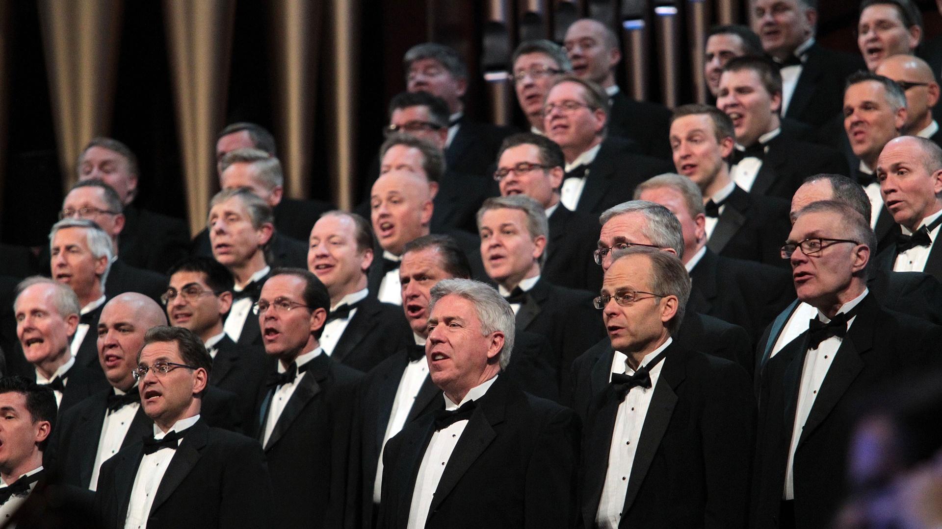 Male members of The Tabernacle Choir singing.