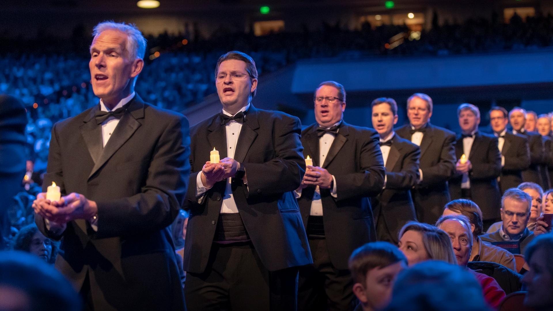 Male members of The Tabernacle Choir singing.