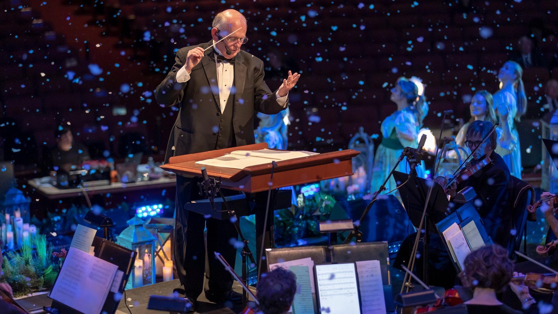 Kristin Chenoweth singing with The Tabernacle Choir behind her,