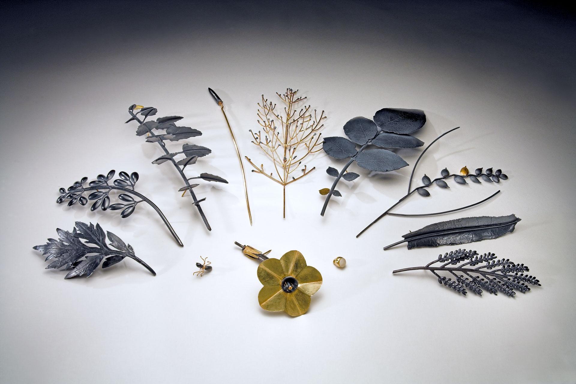 JAN YAGER'S THE TIARA OF USEFUL KNOWLEDGE, 2006, IS SHOWN HERE IN ITS PARTS: EIGHT BROOCHES, TWO STICK PINS, A TIE TACK AND A PENDANT
