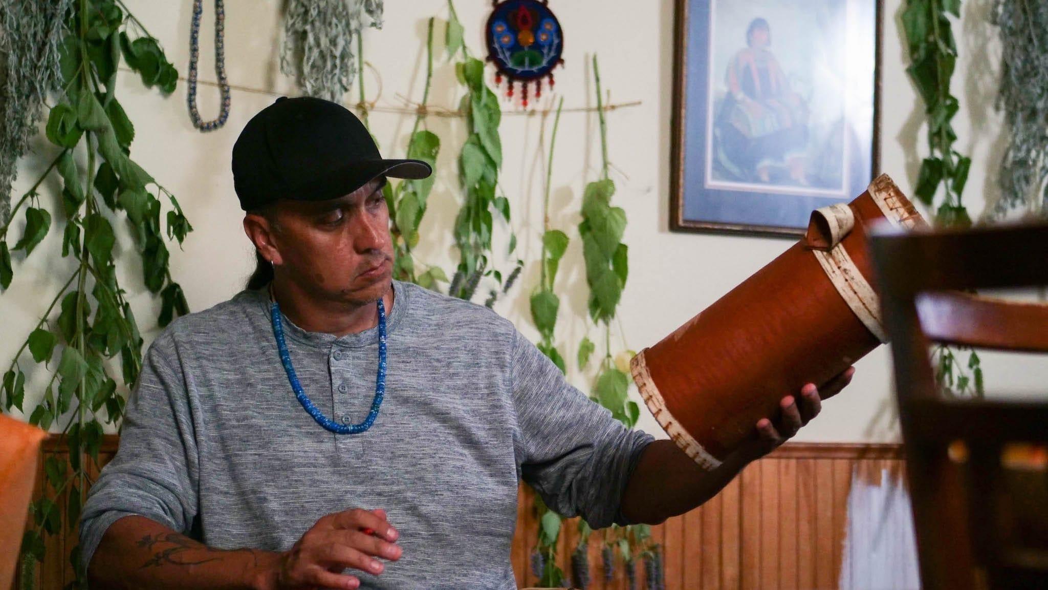 Biskakone Greg Johnson decorates a birch bark basket. Denise Kang photo, Craft in America