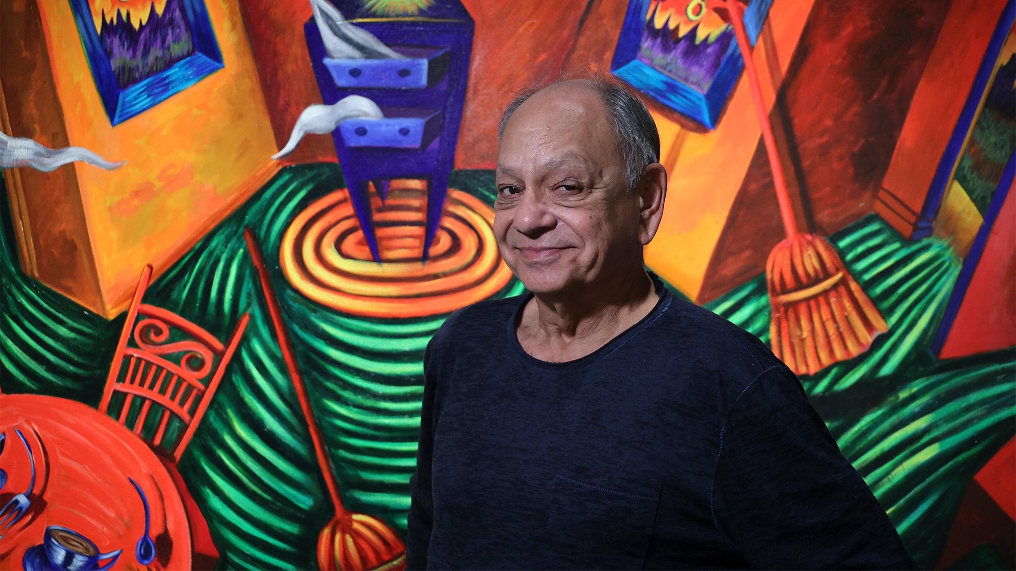 Cheech Marin in front of work by Patssi Valdez, Courtesy of Riverside Art Museum, Carlos Puma photo