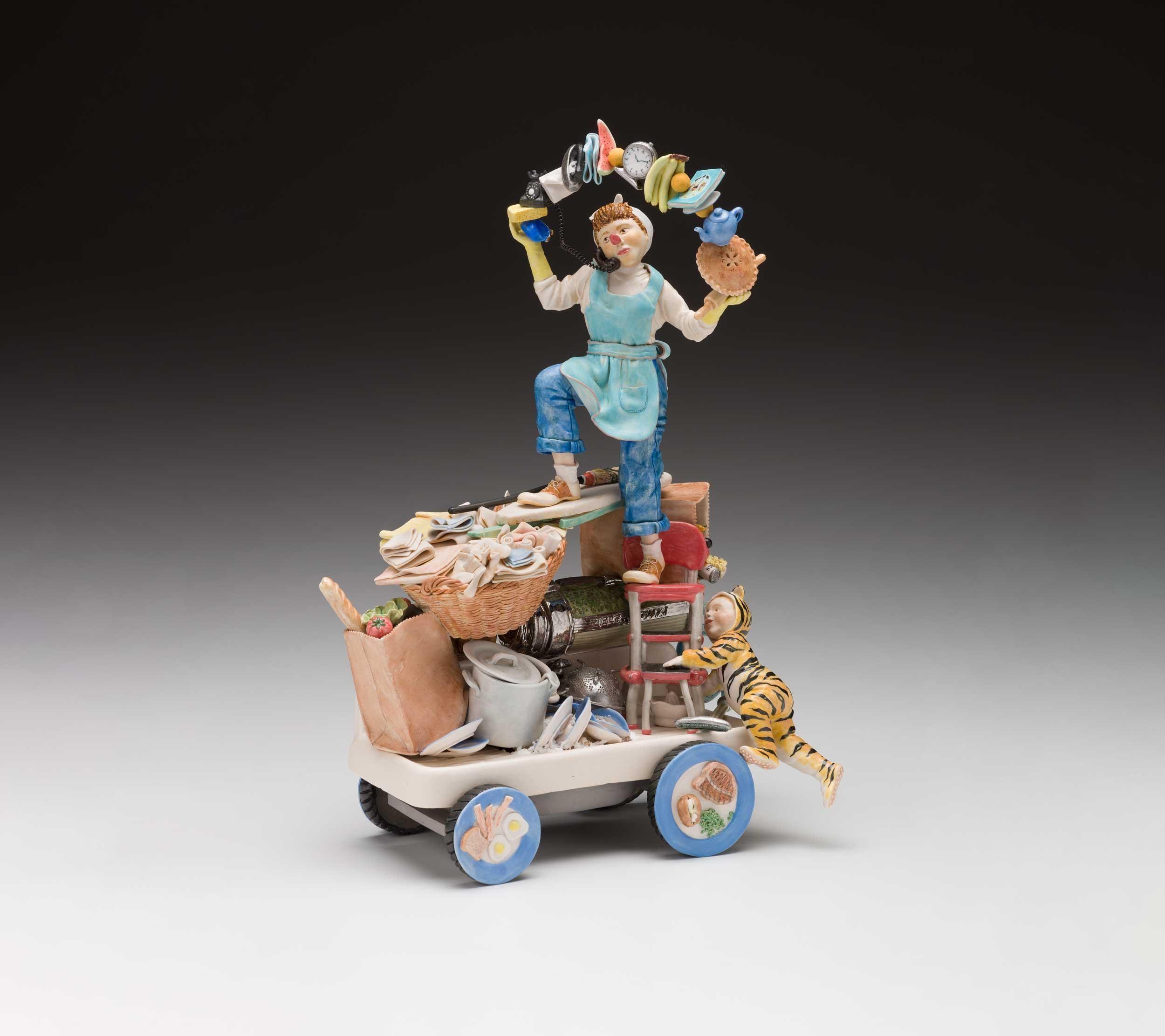 Kathryn McBride (American, 1950-2012), Mother’s Balancing Act: Cirque C’est La Vie Series, 2003, glazed porcelain, 14.63 x 10.5 x 6.5″, Kamm Collection
