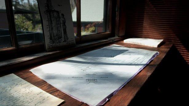Diagrams laid out on a wood table.