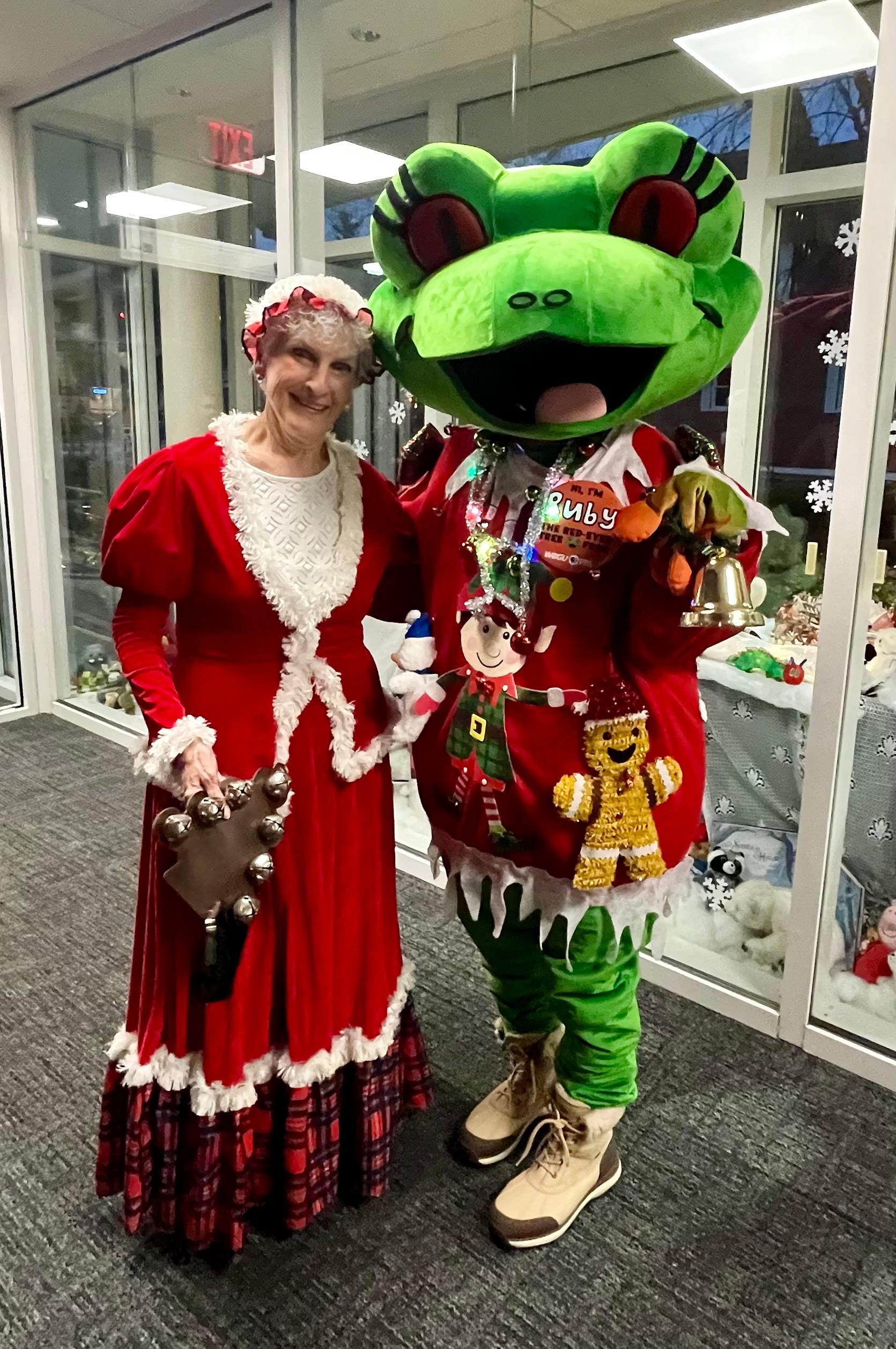 Ruby standing next to Mrs. Claus.