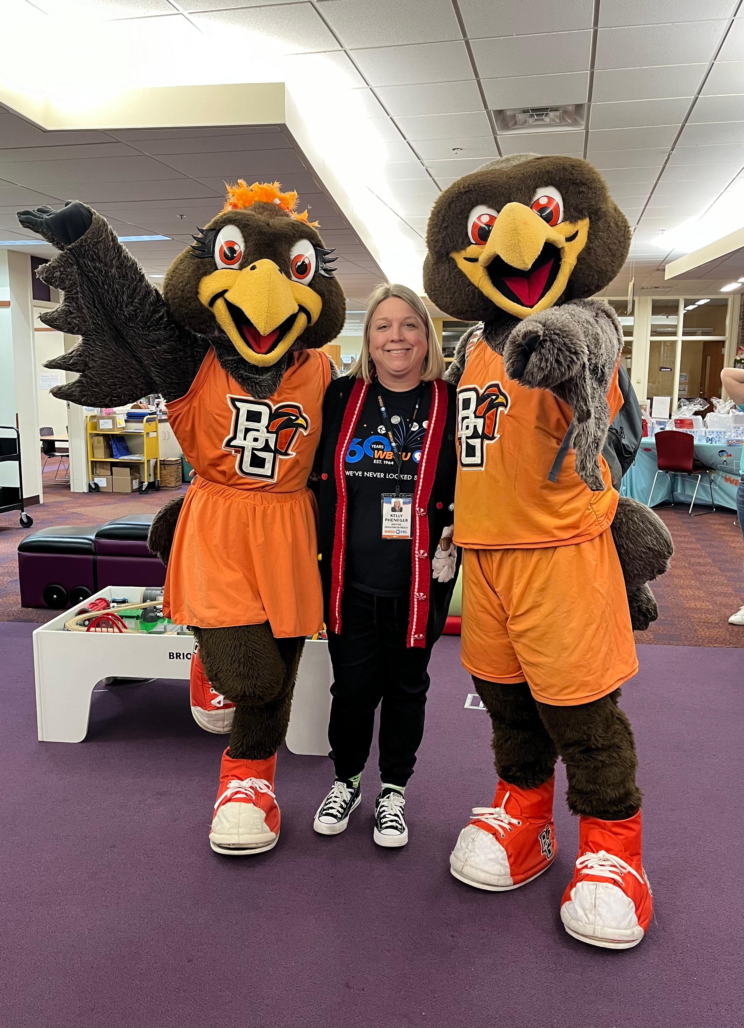 WBGU employee standing with Freddy and Frieda.