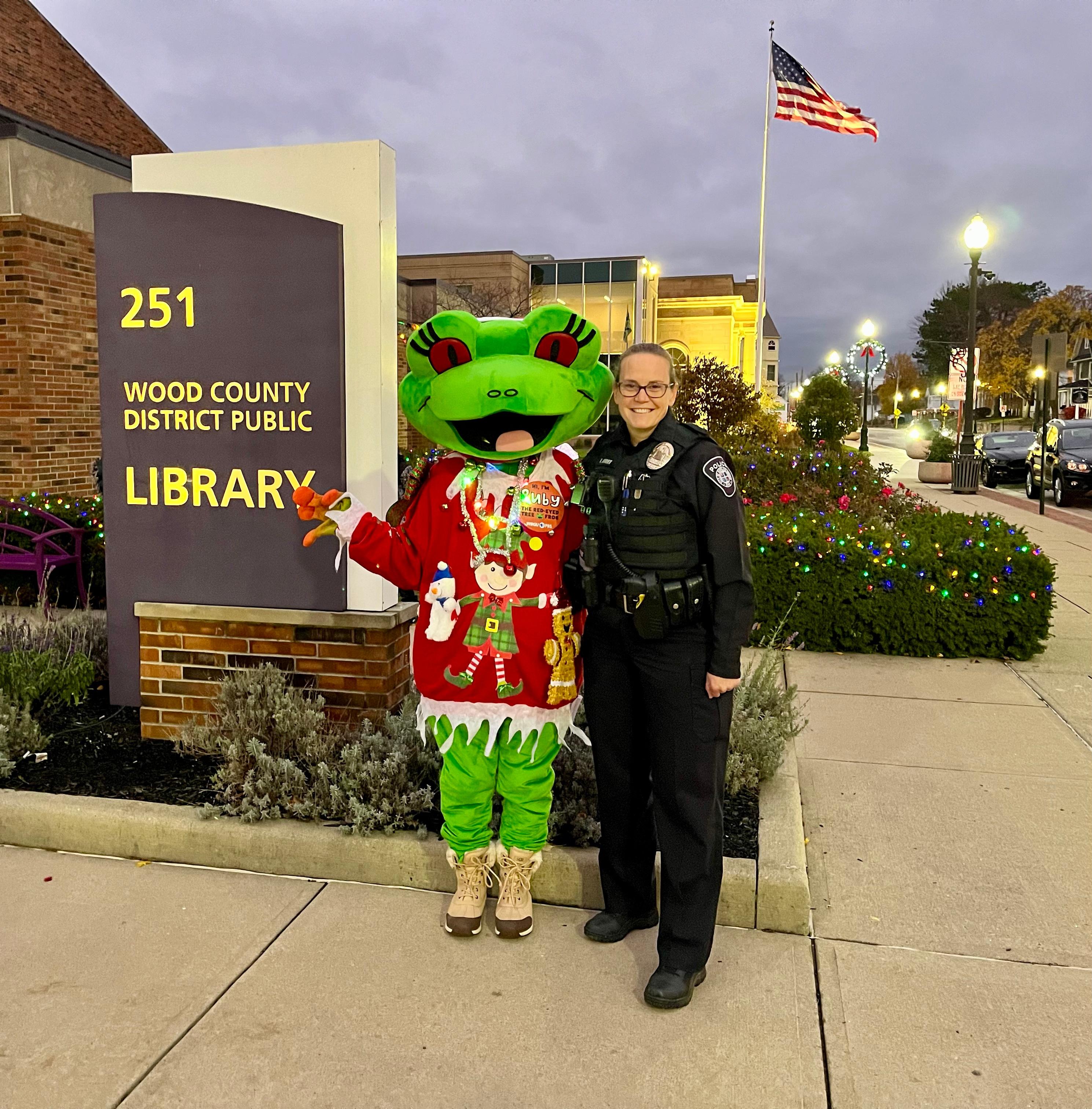 Ruby and a police officer posed outside of the Wood County District Public Library.