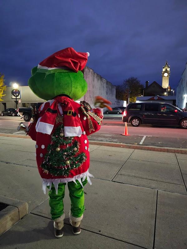 Ruby showing off the christmas tree on the back of her ugly sweater.