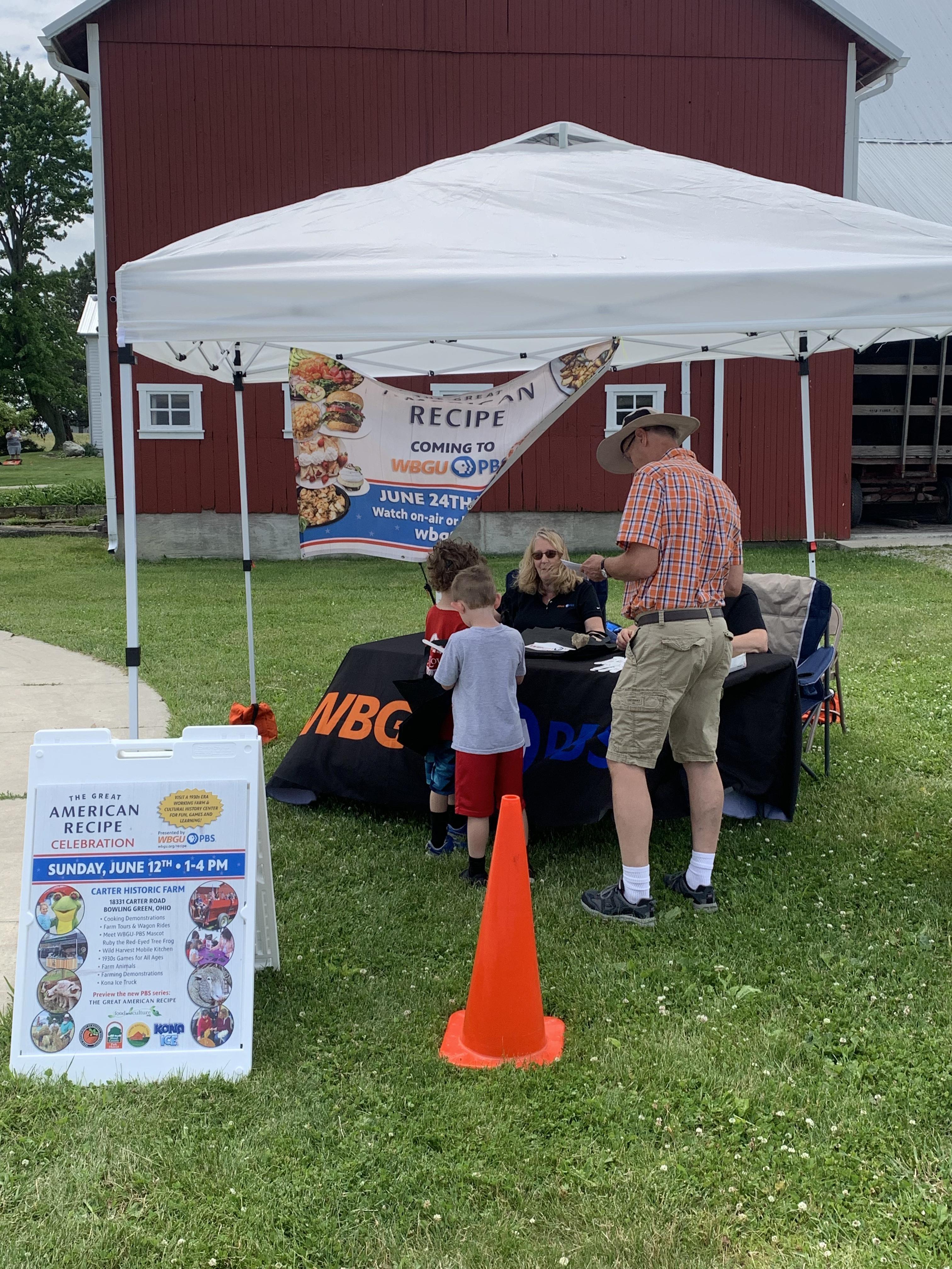 kids outside at WBGU tent/table