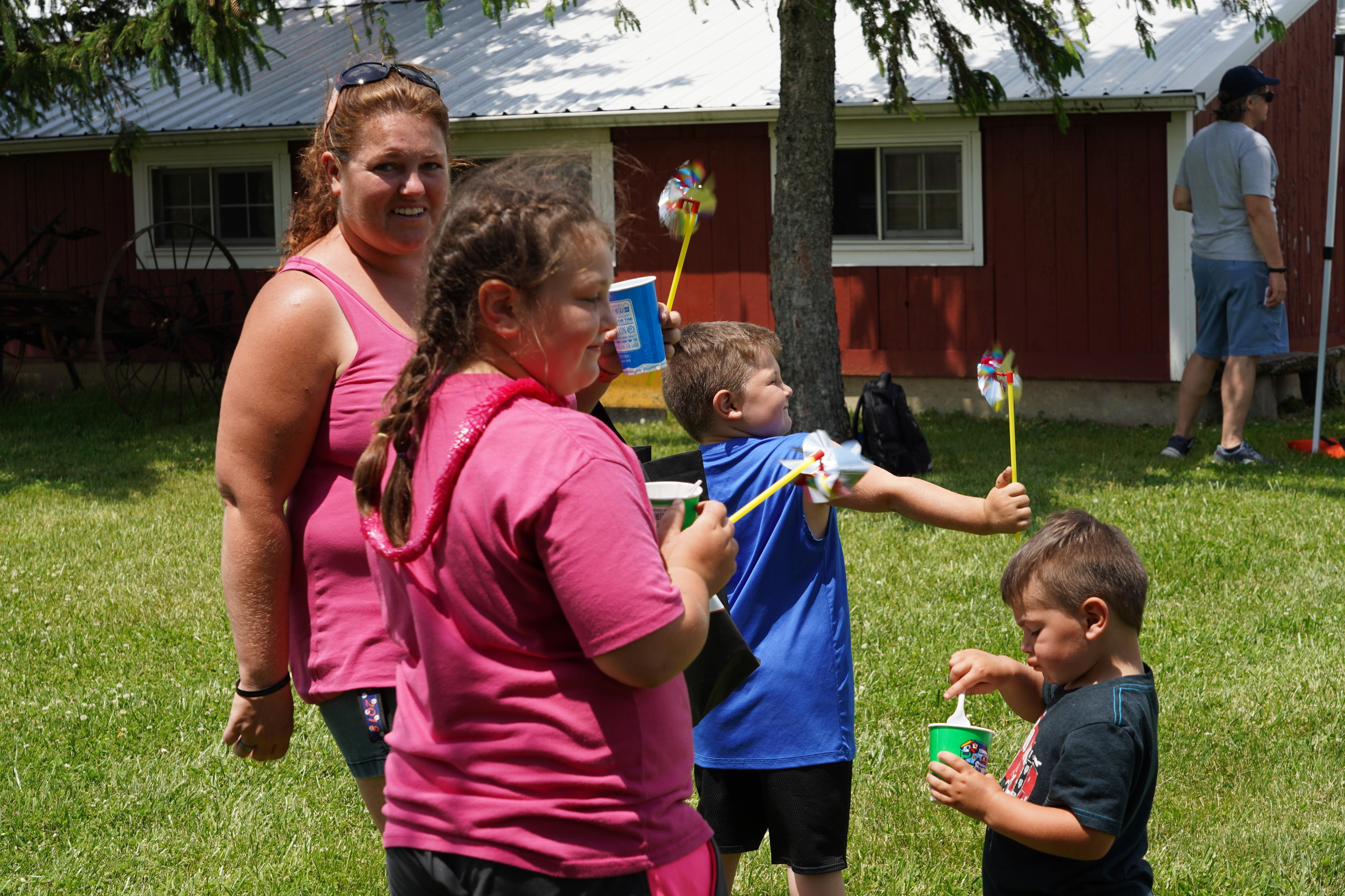 children playing with pinwheels