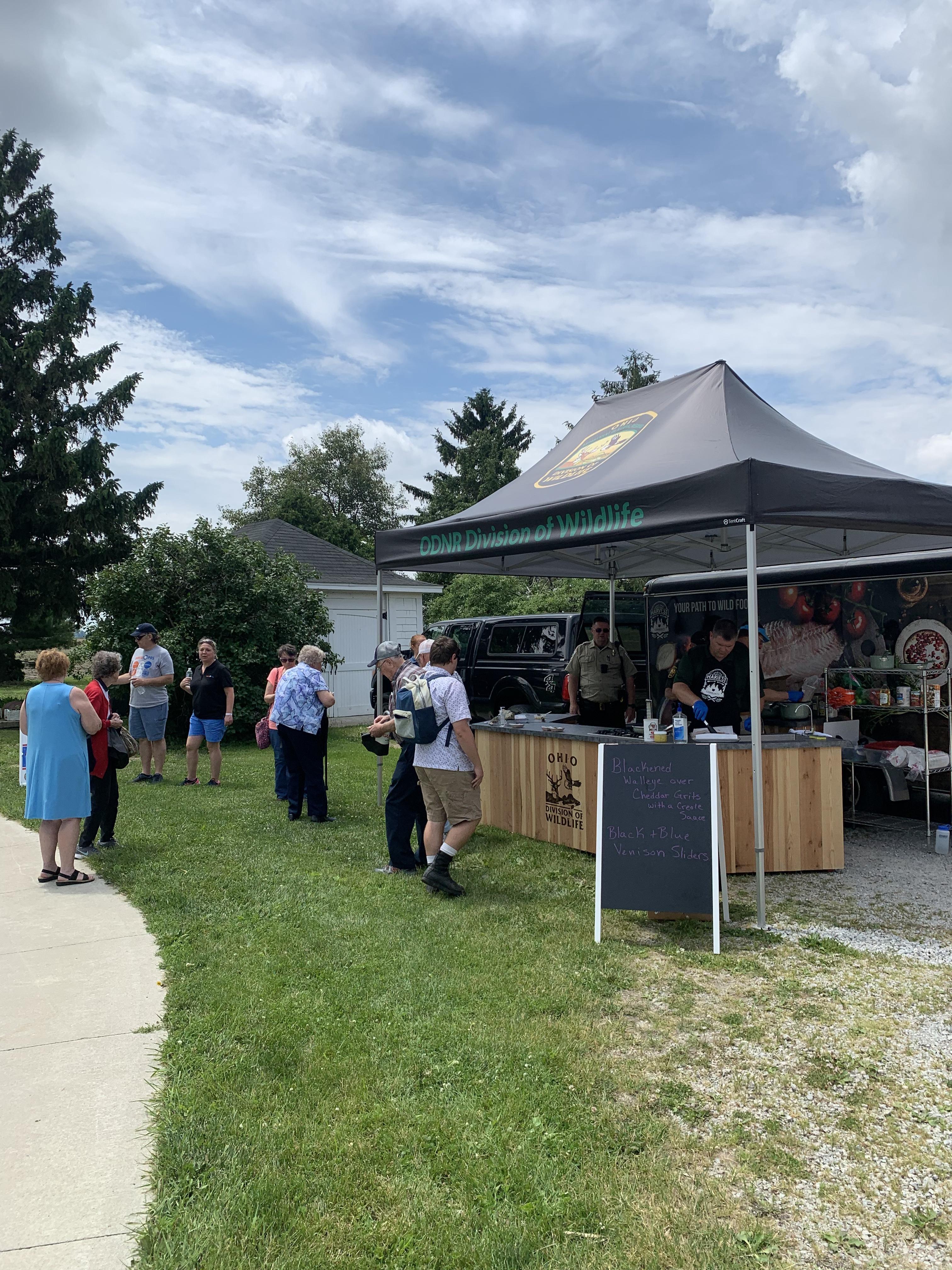 outdoor picture of tent and patrons