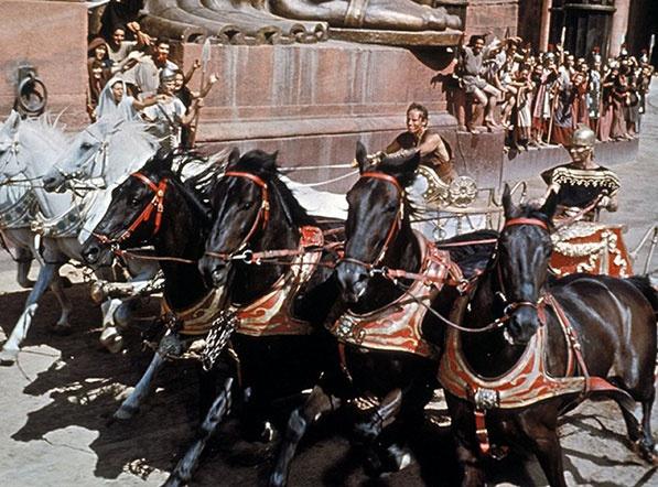 This image captures the iconic chariot race scene from the 1959 epic film Ben-Hur. 