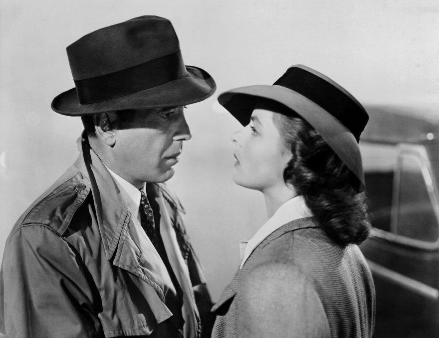 Black and white photo of Humphrey Bogart (as Rick Blaine) and Ingrid Bergman (as Ilsa Lund) during the famous airfield scene at the end of Casablanca.