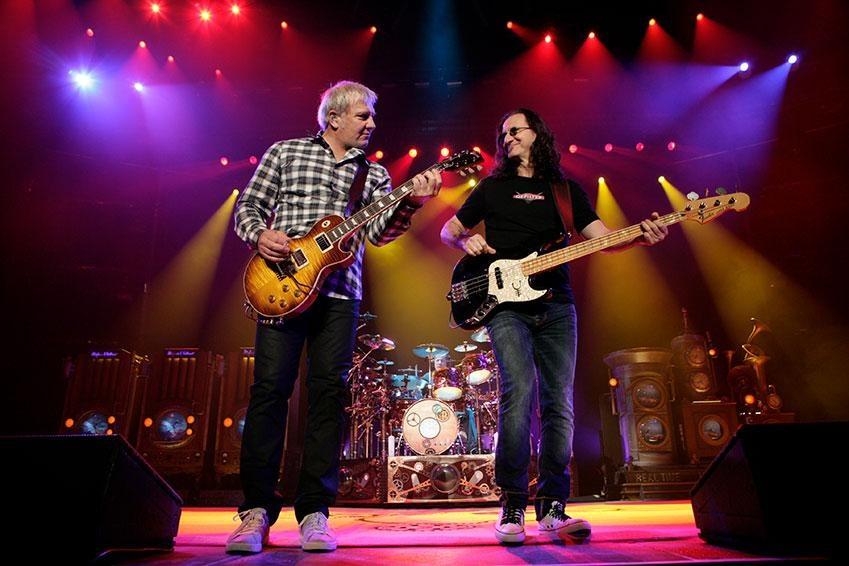 Picture of Rush guitarist Alex Lifeson and Singer/bass player Geddy Lee playing on stage