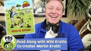 Wild Kratts creator holding a cat