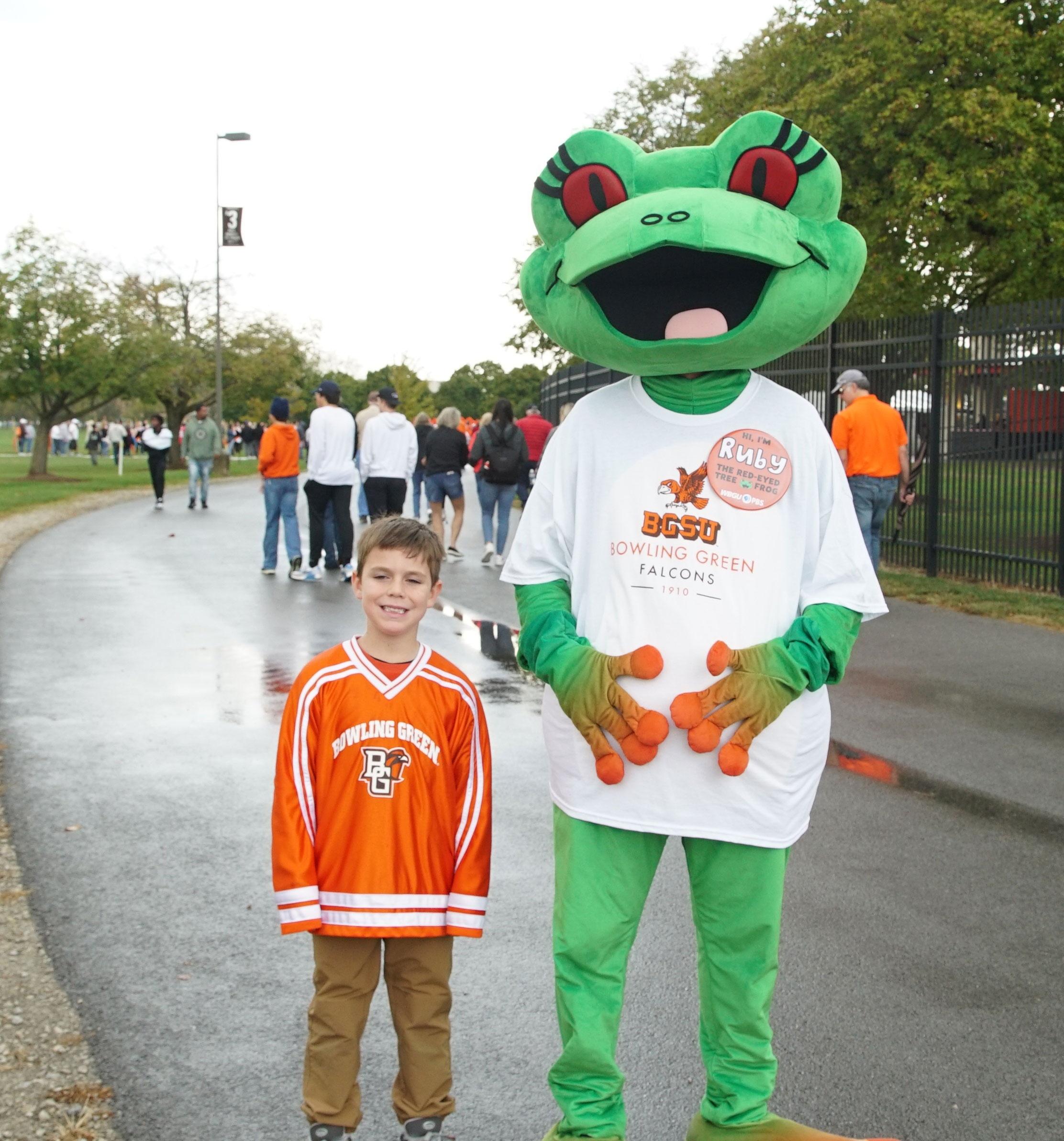 Station mascot Ruby with boy