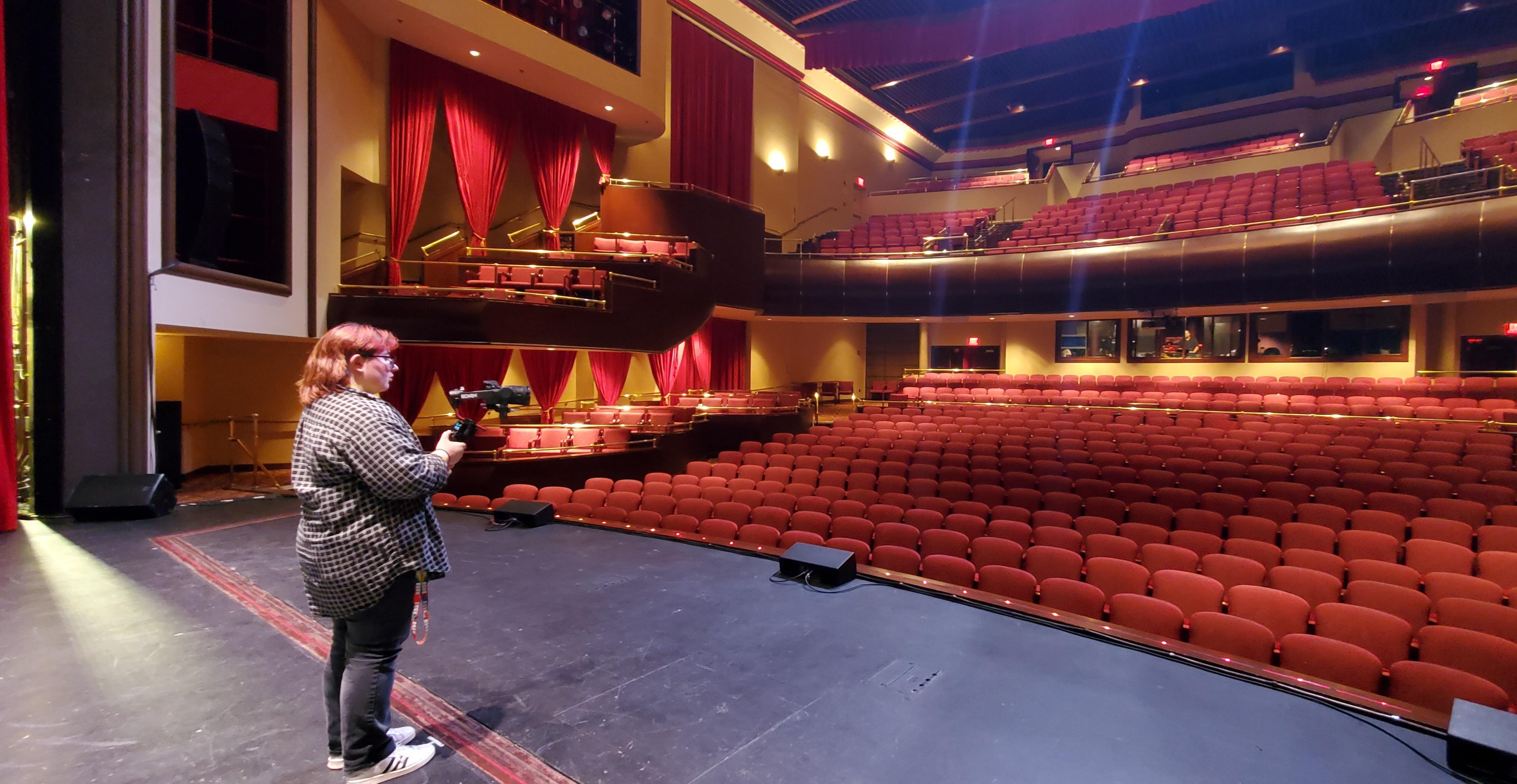 Videographer on a theater stage