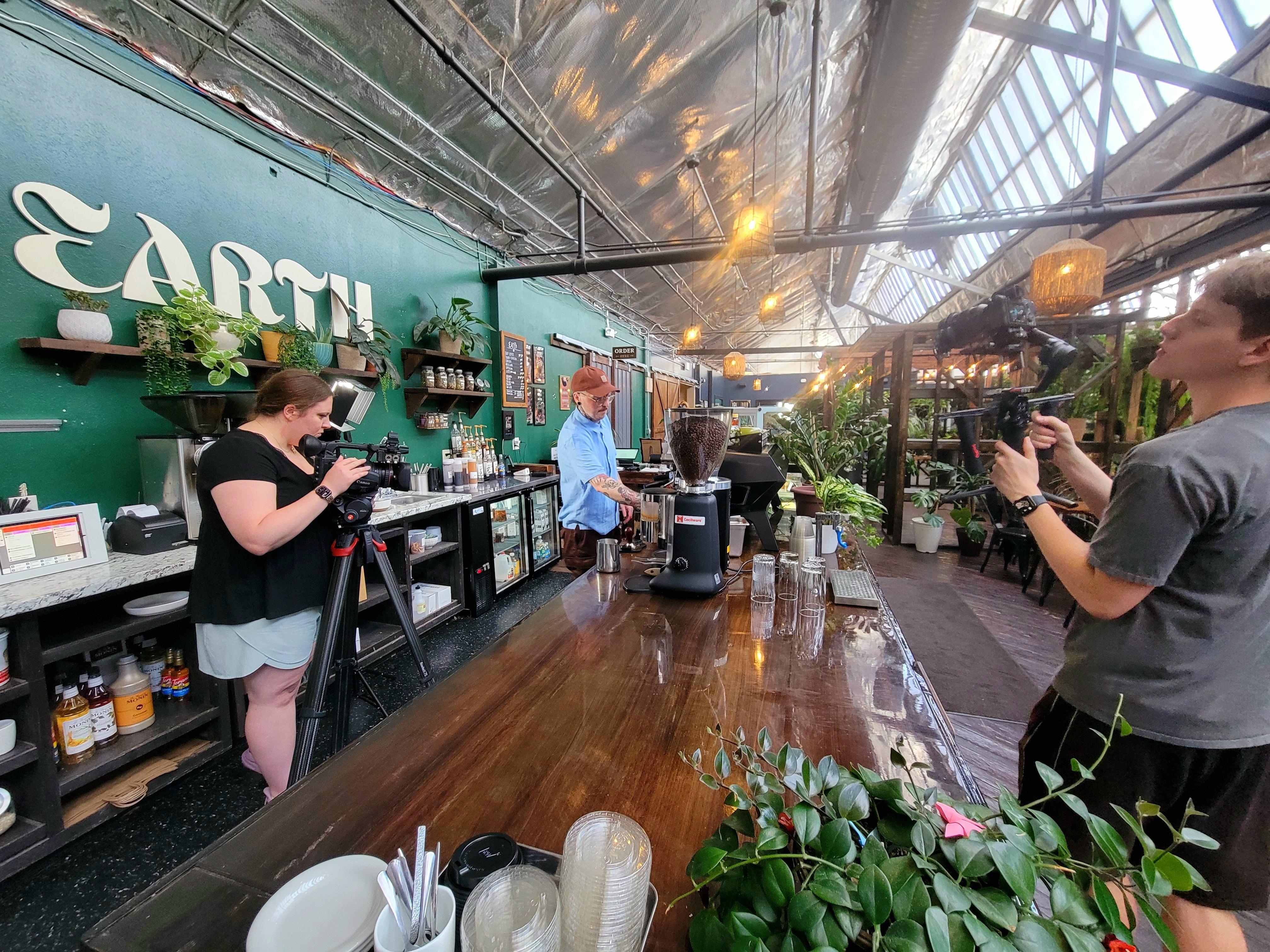 Video crew taping in a coffeehouse