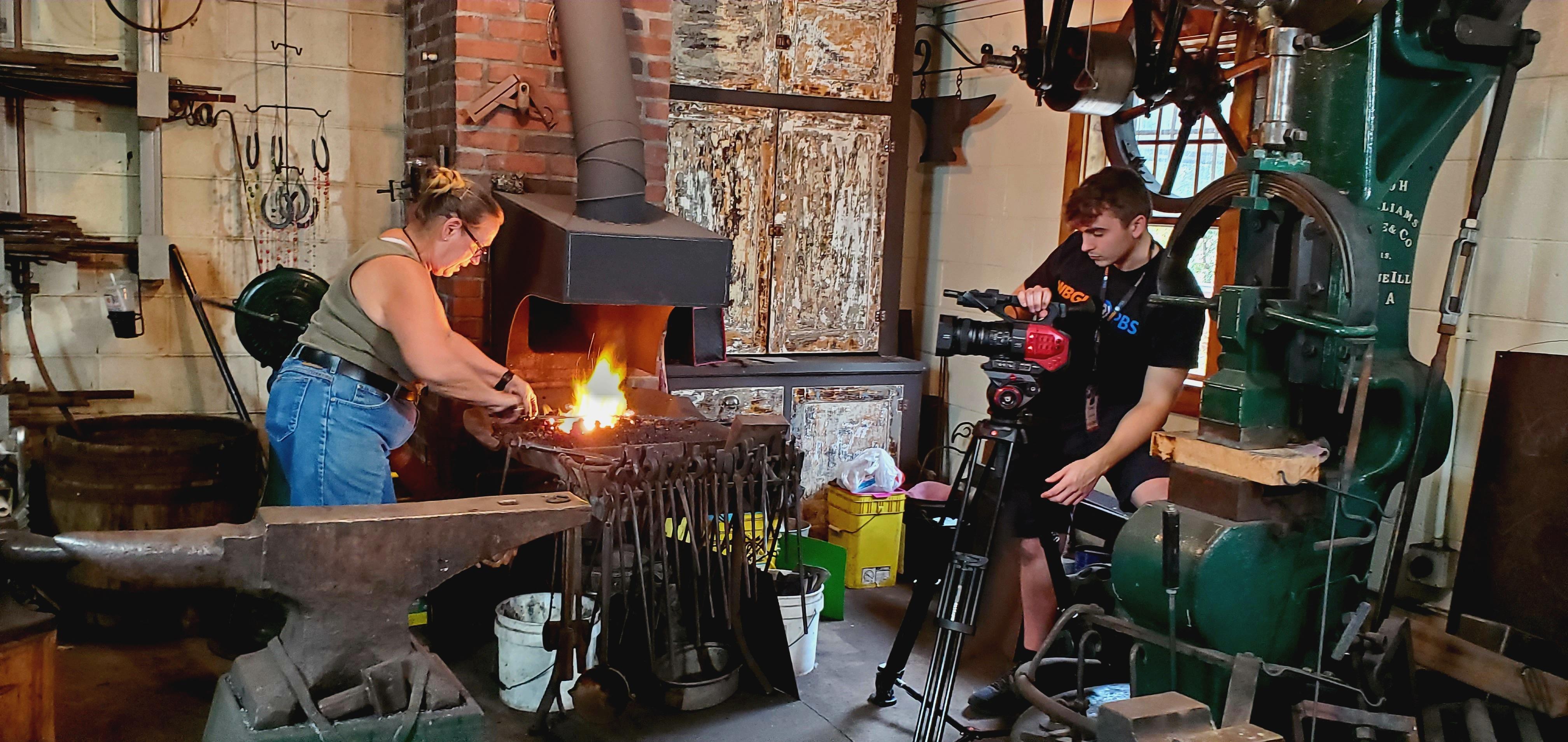 Blacksmith with iron on a flame
