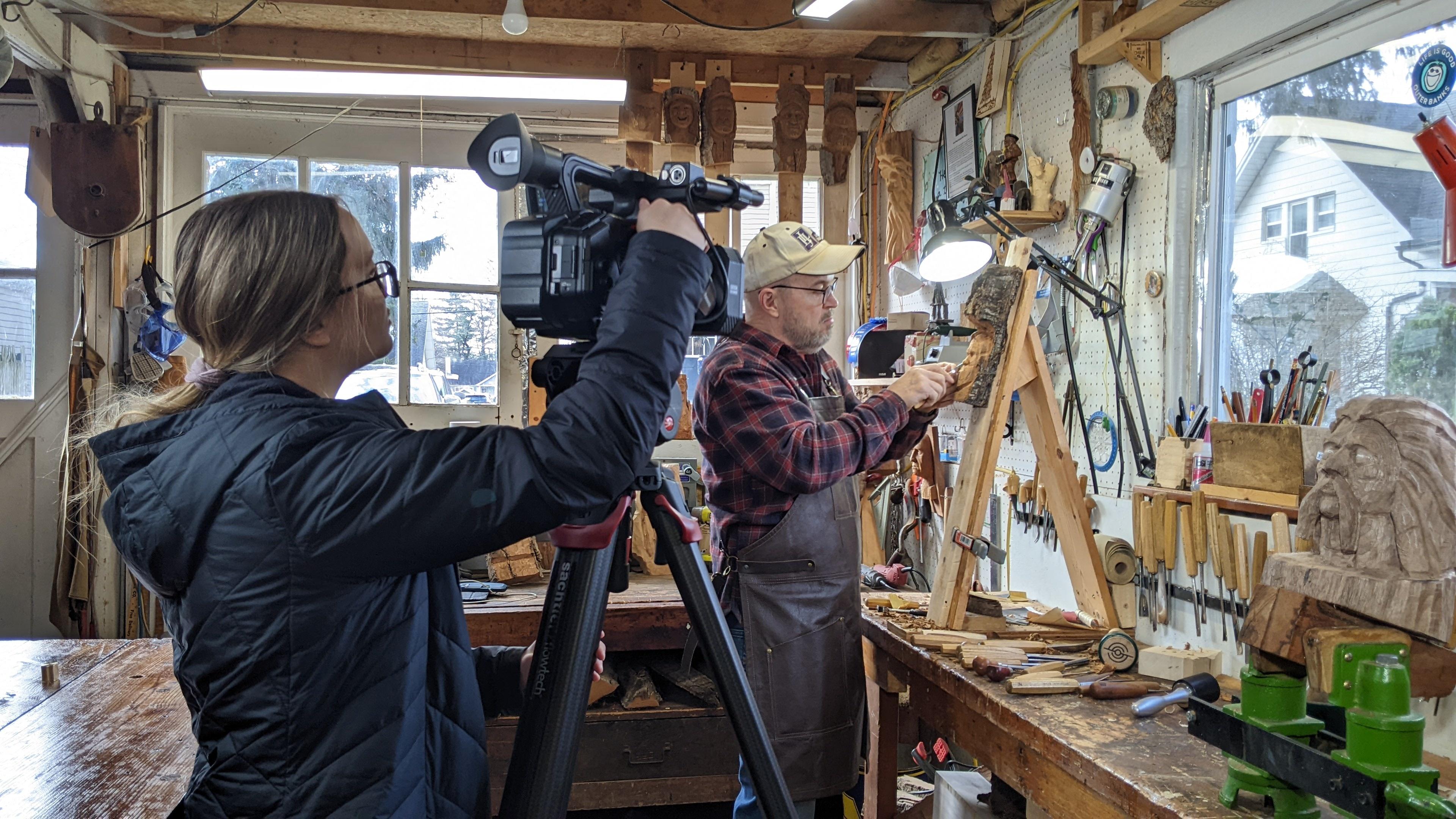 Woodcarver working in his studio.