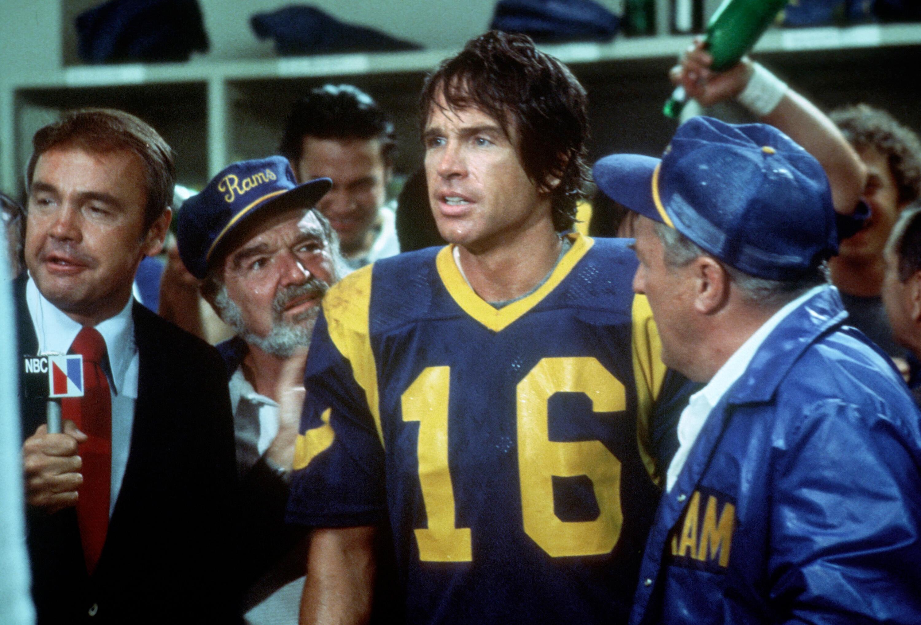 Warren Beatty dressed as a football player