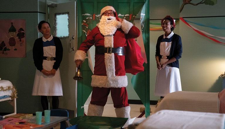 Santa and 2 nurses in hospital room