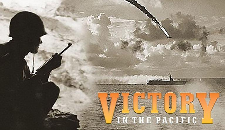 Soldier looking at a battleship in the Pacific ocean