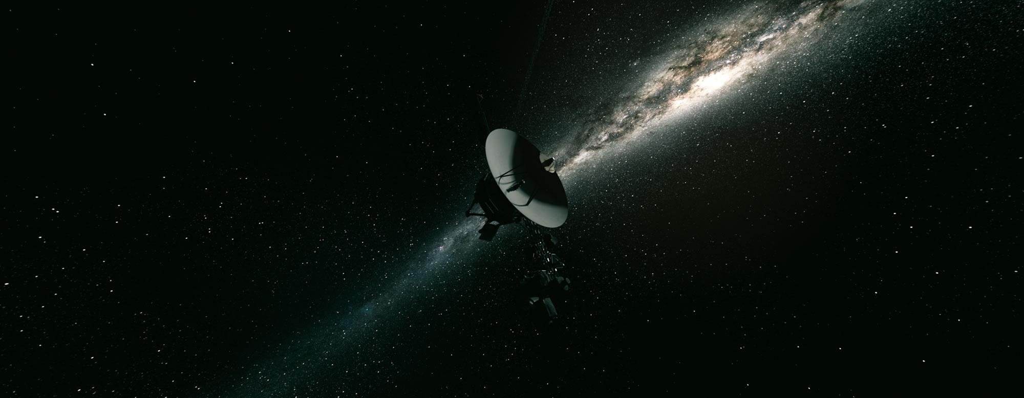 Voyager spacecraft with galaxy in background