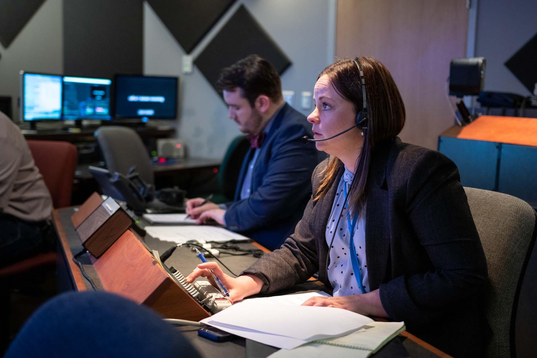 Ruth Brown and Logan Finney in the KAID control room during a live GOP primary debate