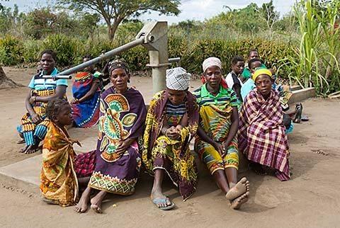 Women around water pump built by Gorongosa Restoration Project - photo by Katherine Jones