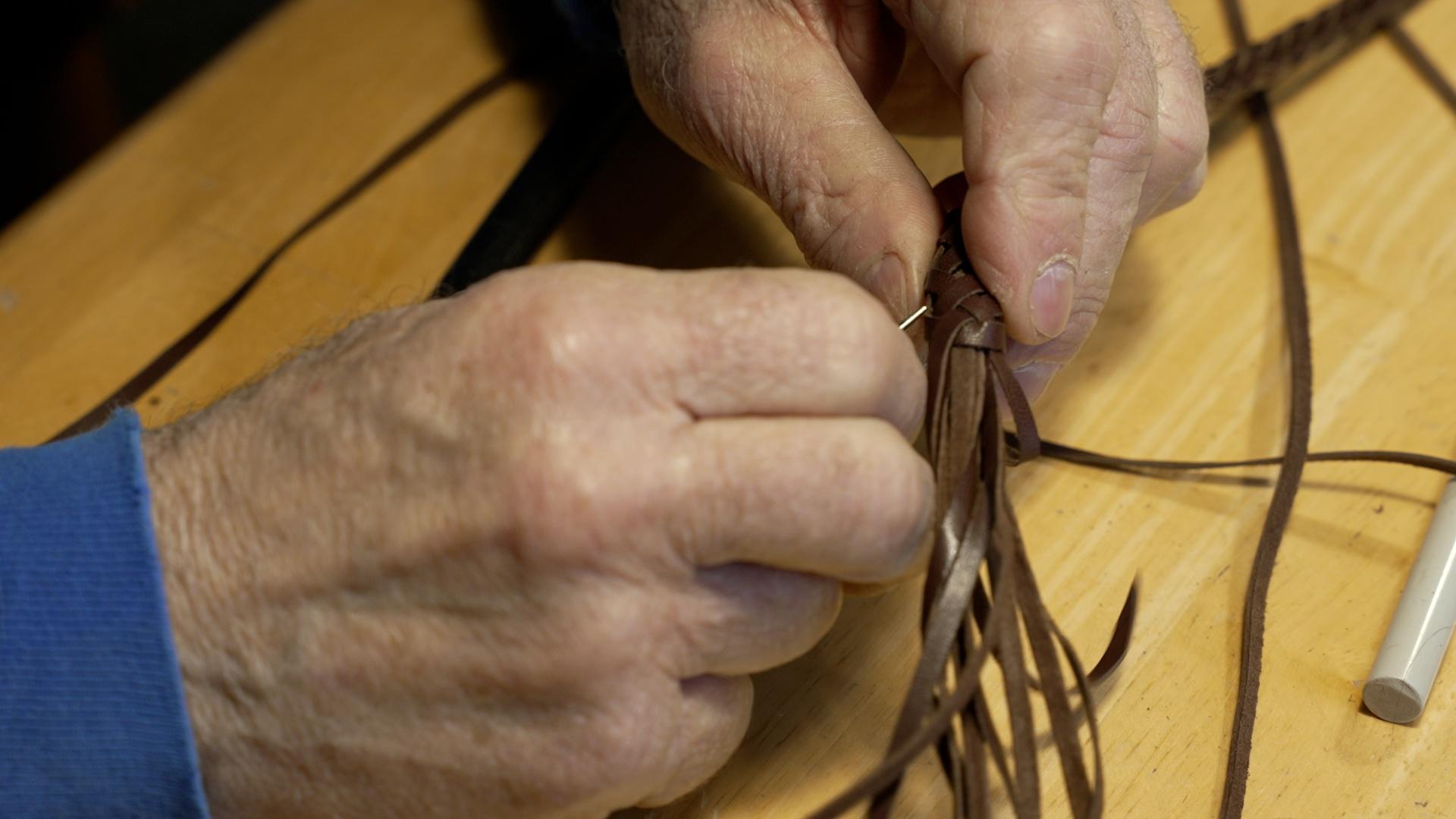 A closeup of “pineapple knots” being made by Mike “Hooey” Storch of Donnelly, Idaho. The knots are made by braiding two “Turk’s Head” knots together.