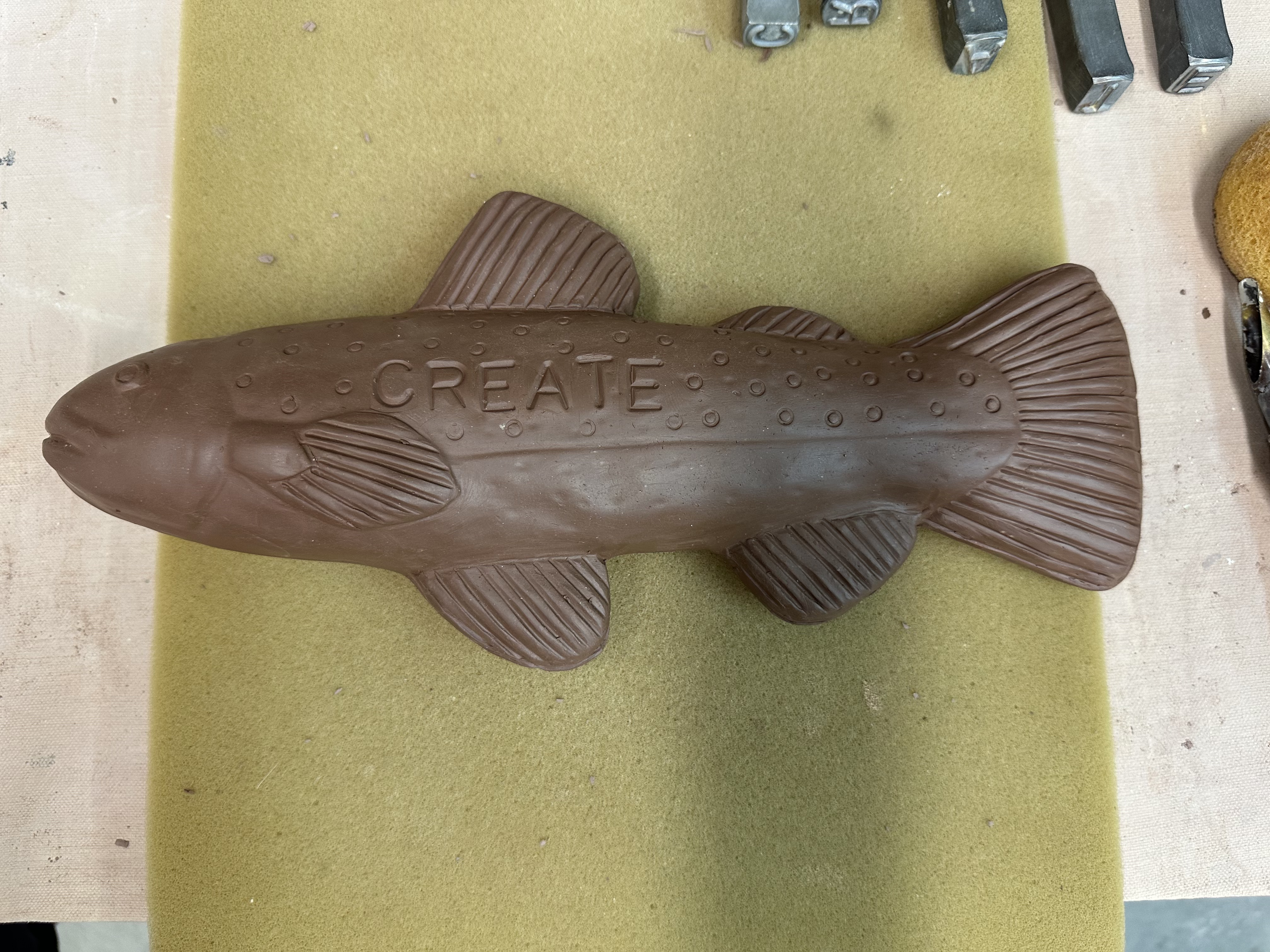 A clay fish before being fired in a kiln