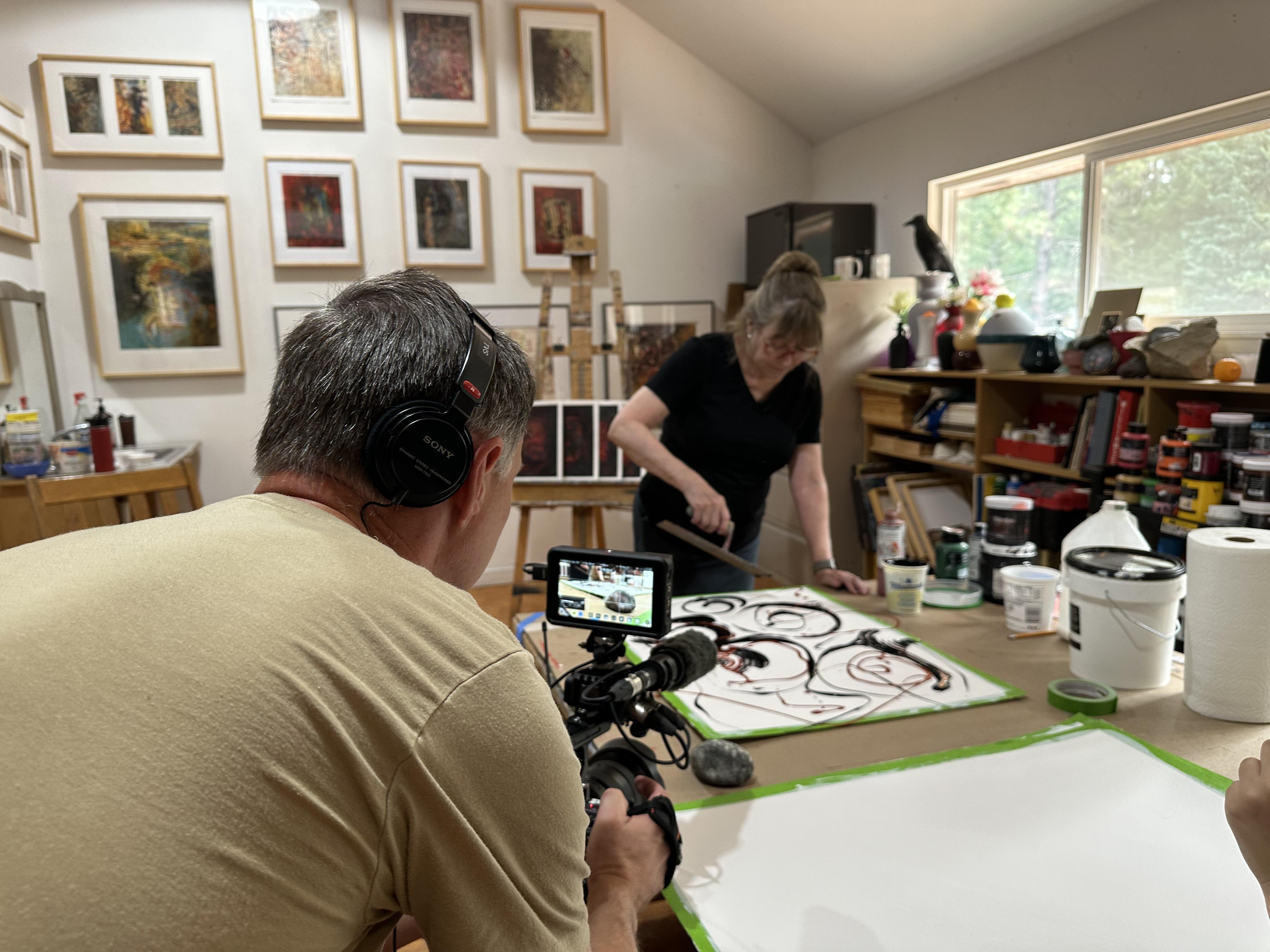 Videographer Troy Shreve filming artist Gail Siegel