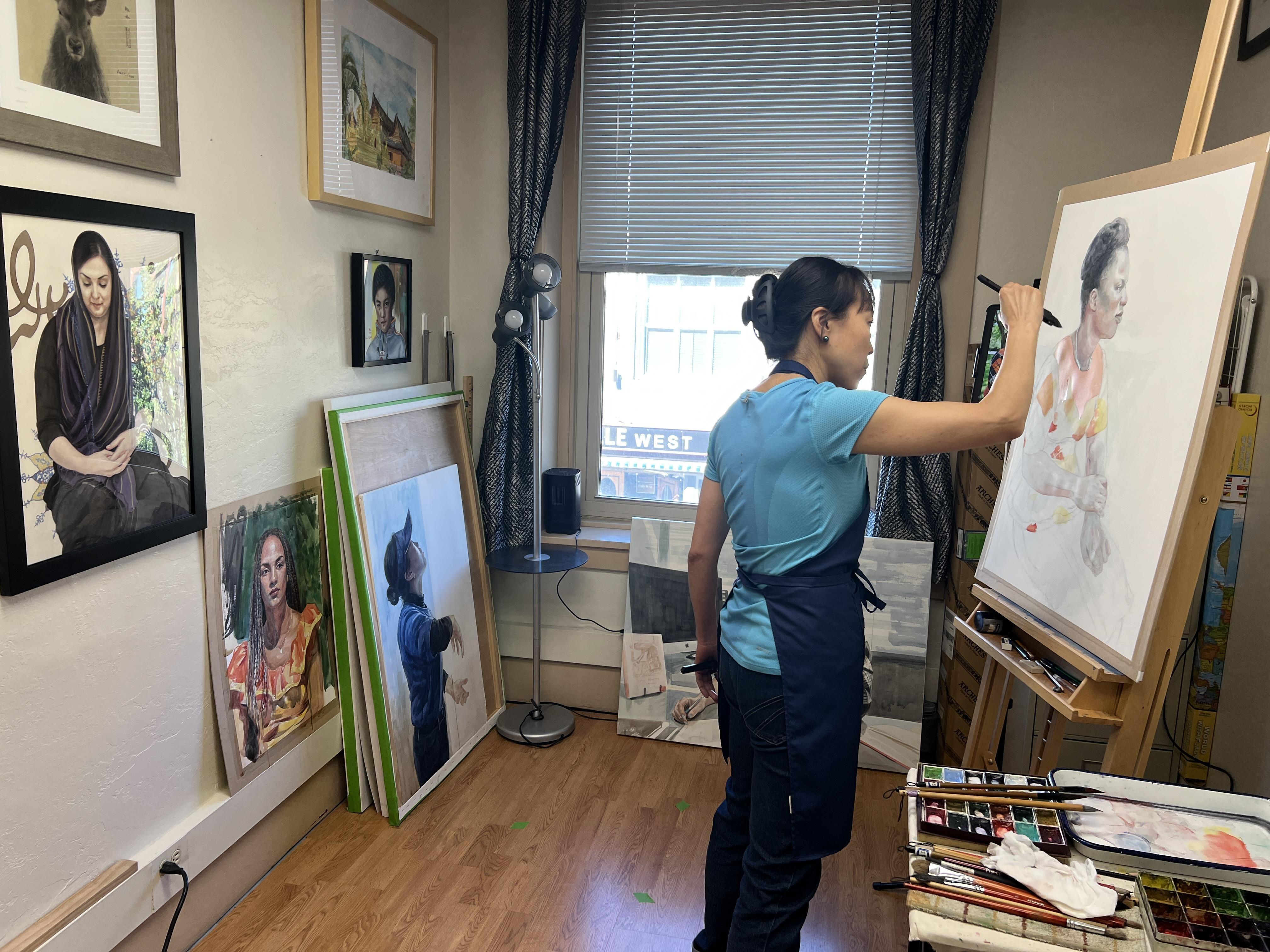 Wide shot of Yidan painting Judith