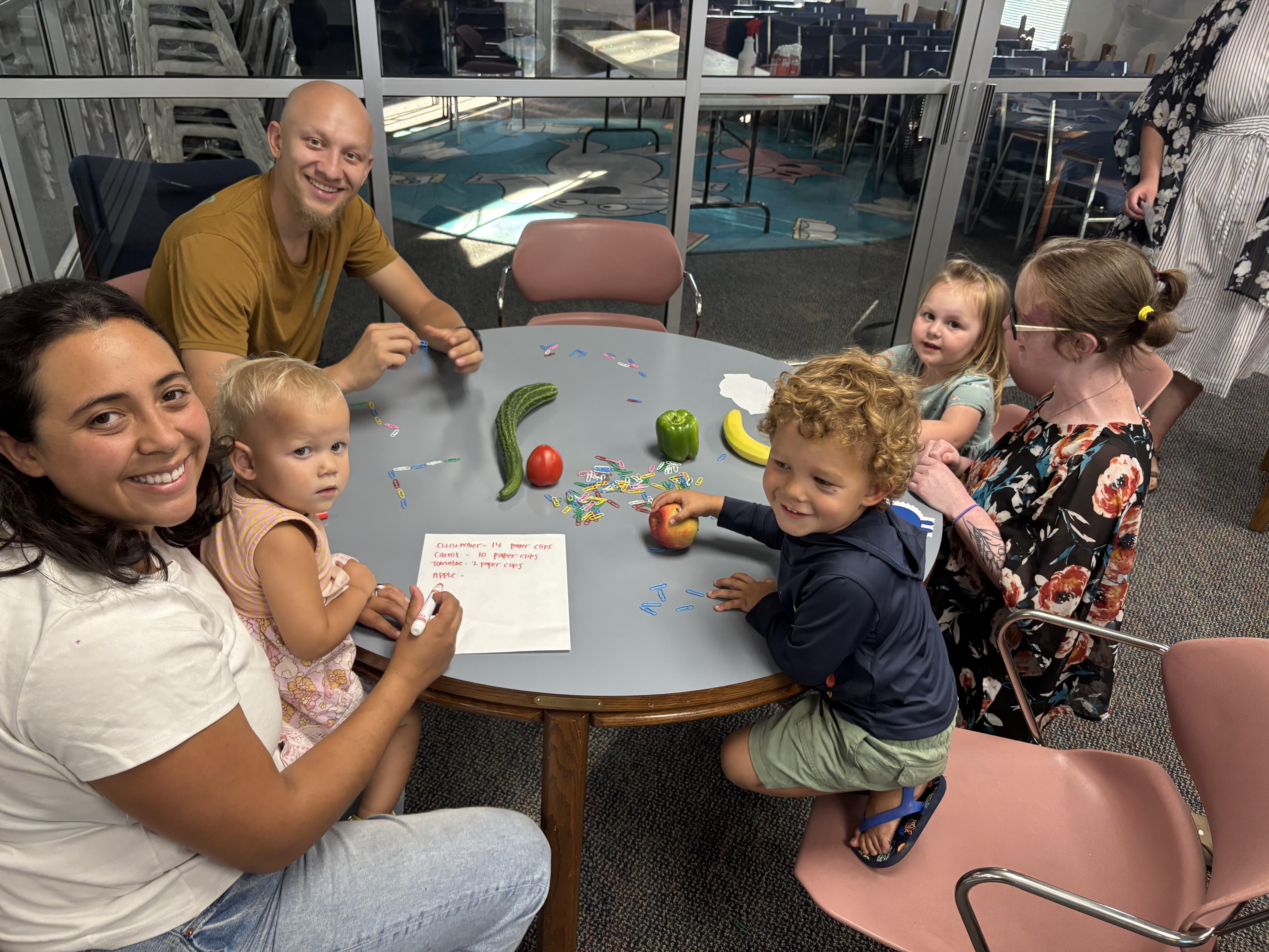Family doing math games around a table