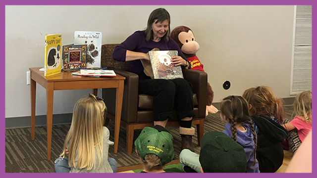 Librarian reading to young children