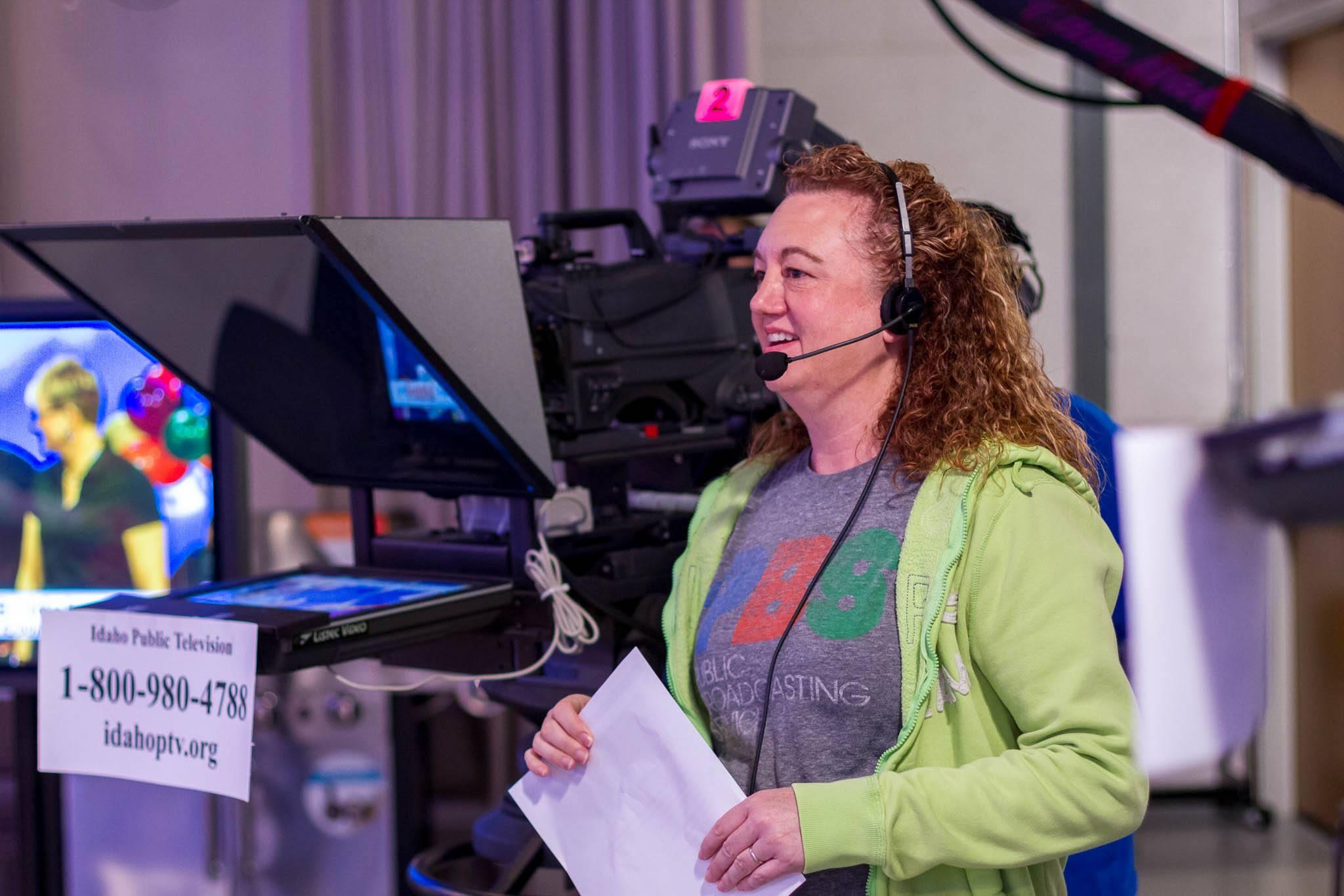 A volunteer floor director