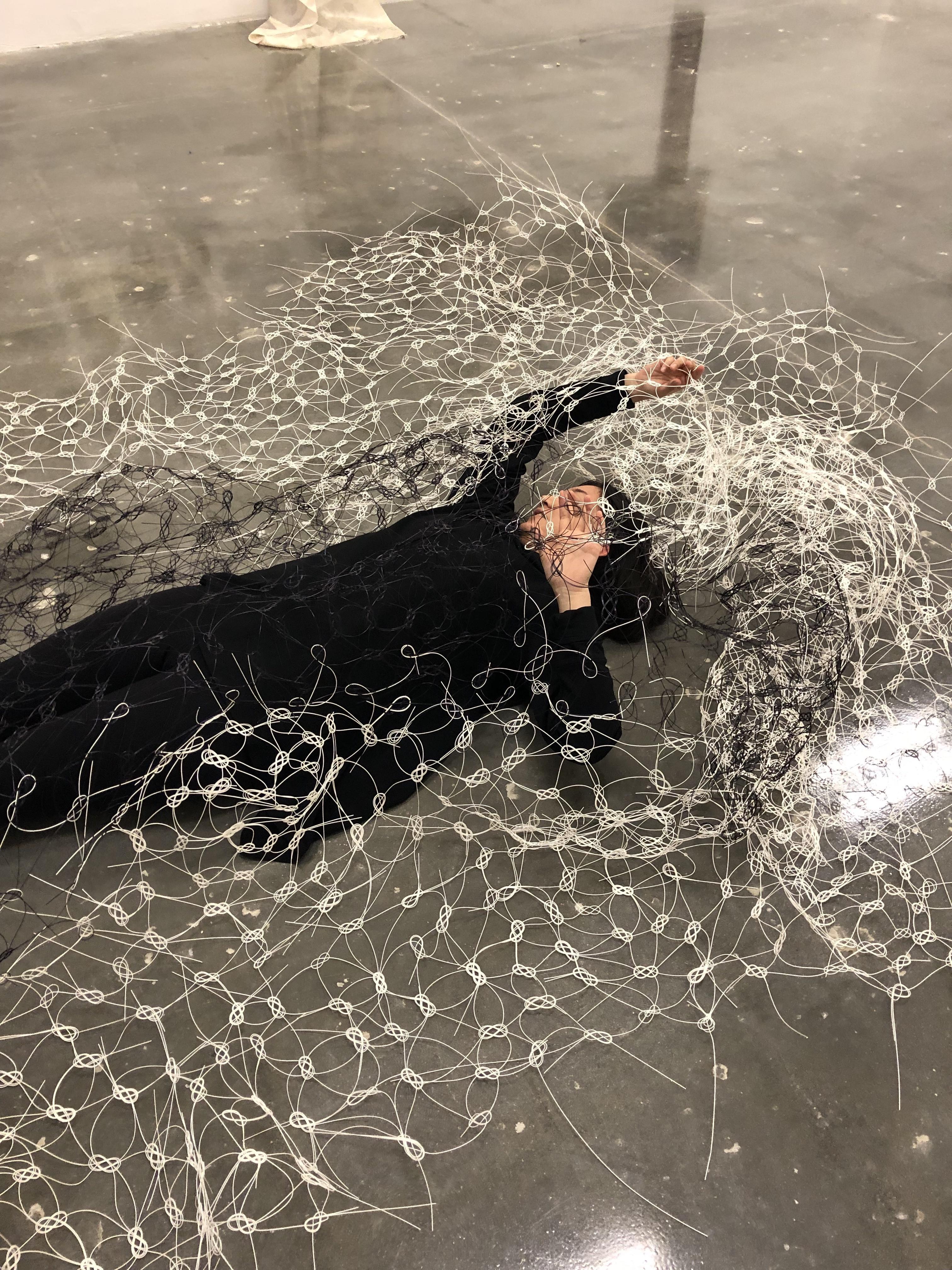 Maxwell underneath “Kuzu,” made from mizuhiki cords tied with thousands of traditional Japanese awaji knots.