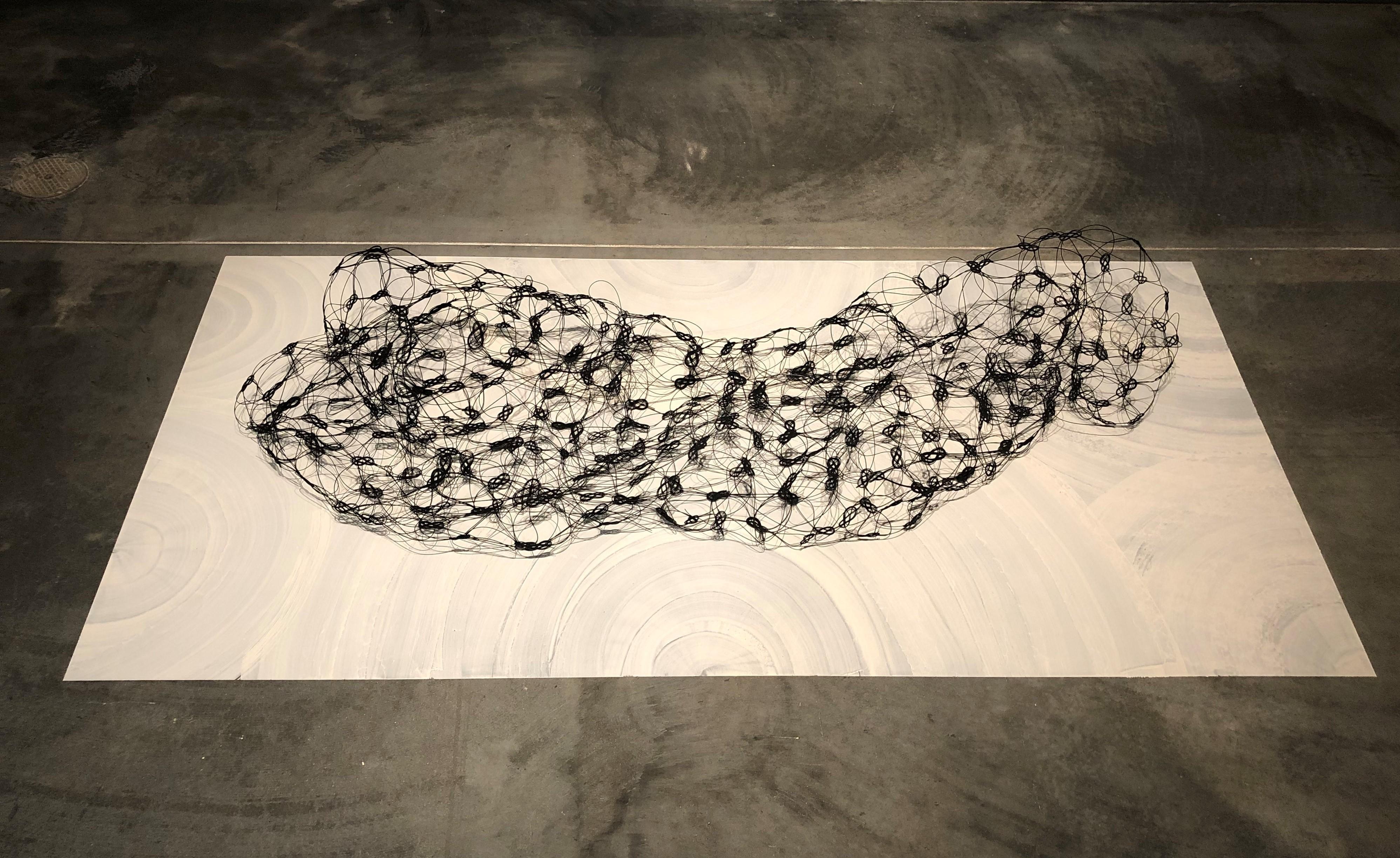 “All That Remains,” Hallie Maxwell, 2024. Silk mizuhiki cords on porcelain slip